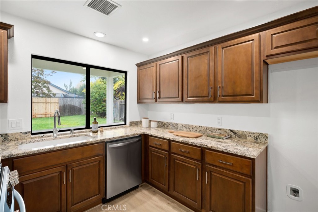 928 Austin Court Paso Robles, CA 93446 - Photo 8 of 30 a kitchen with a sink and a window