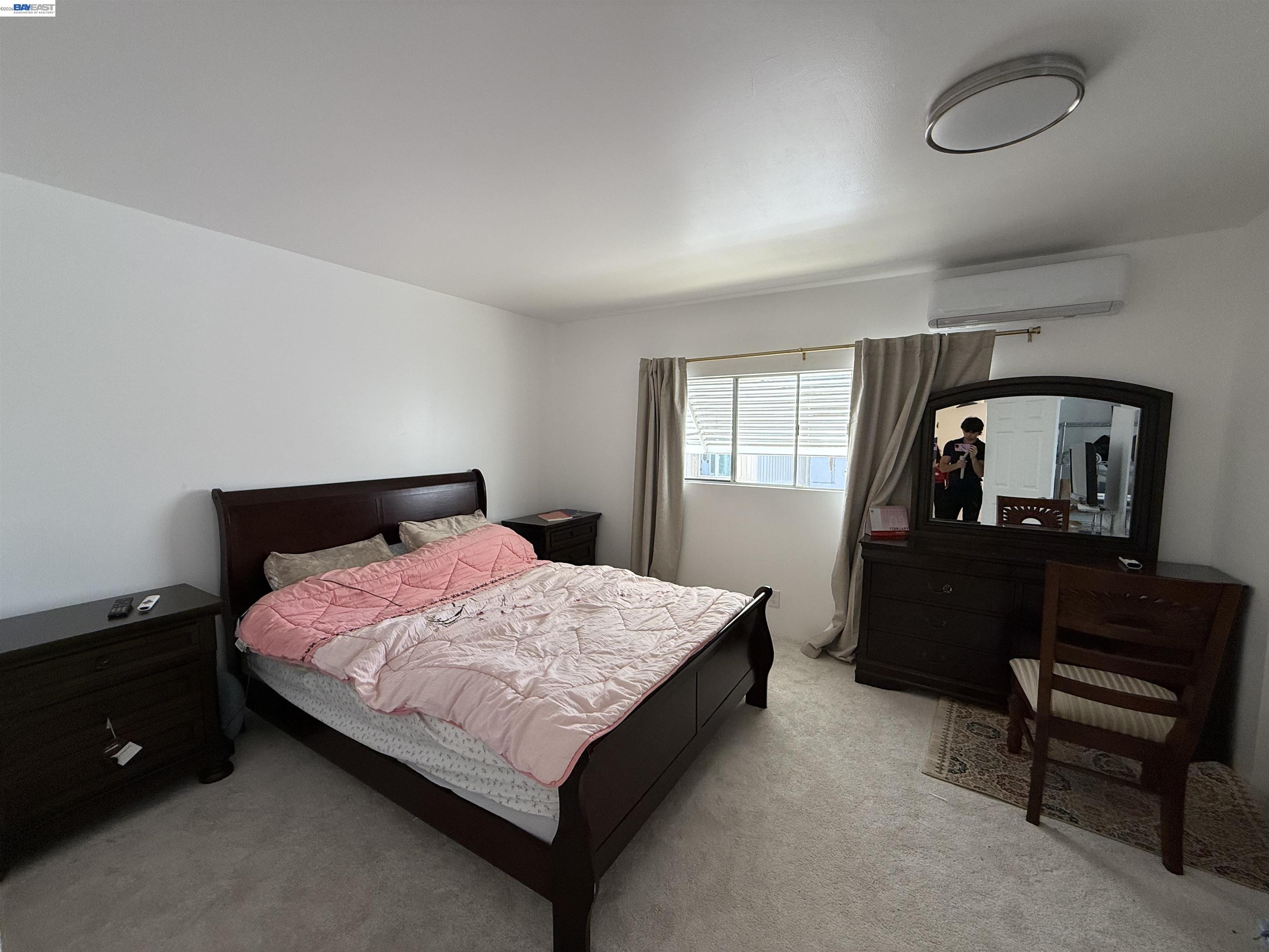 2151 Oakland Road, Unit 324 San Jose, CA 95131 - Photo 1 of 14 a bedroom with a bed and a dresser