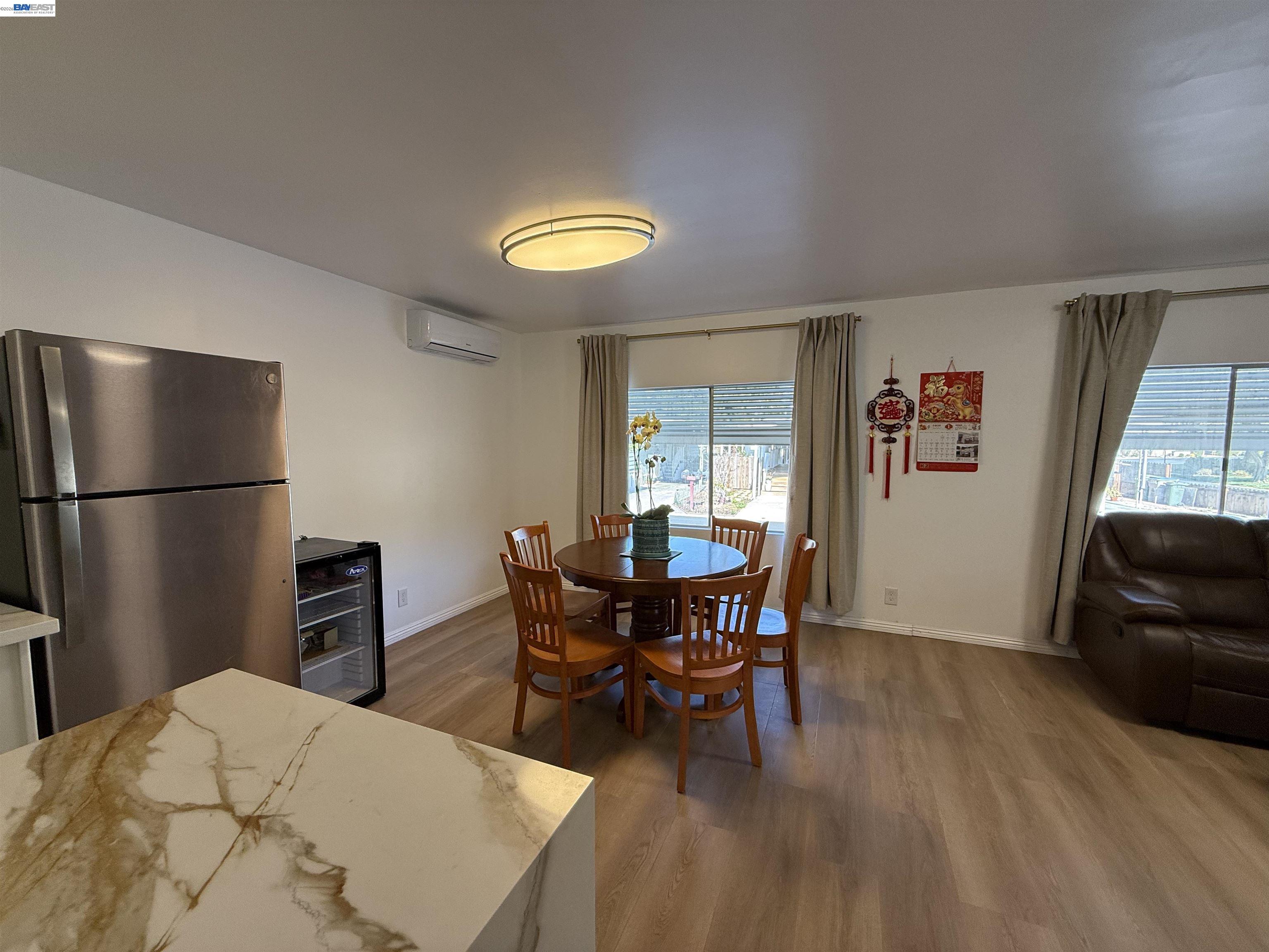 2151 Oakland Road, Unit 324 San Jose, CA 95131 - Photo 11 of 14 a view of a livingroom with furniture and wooden floor
