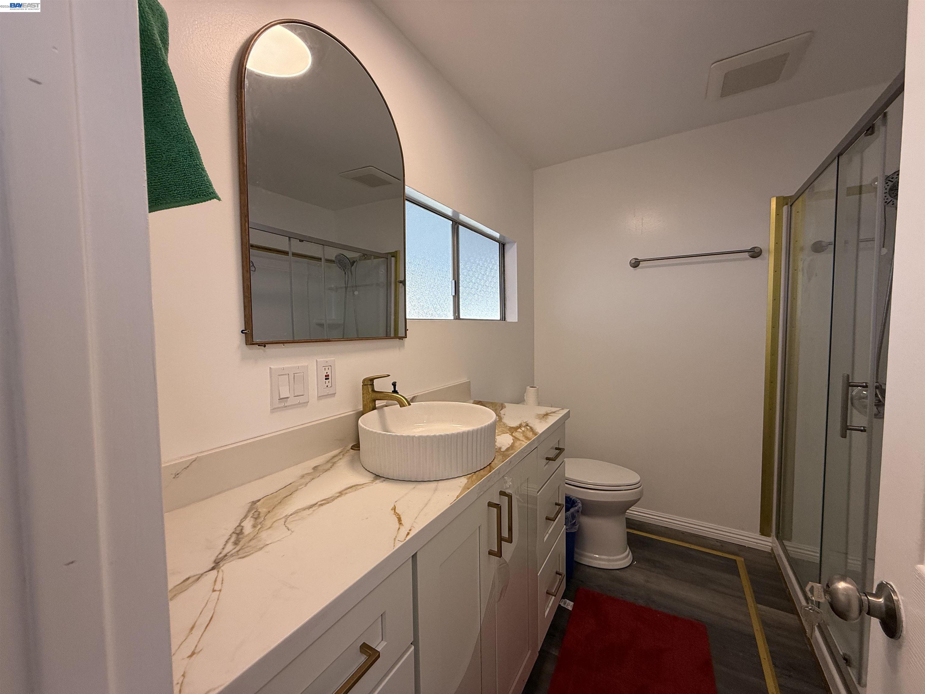 2151 Oakland Road, Unit 324 San Jose, CA 95131 - Photo 13 of 14 a bathroom with a sink toilet and shower