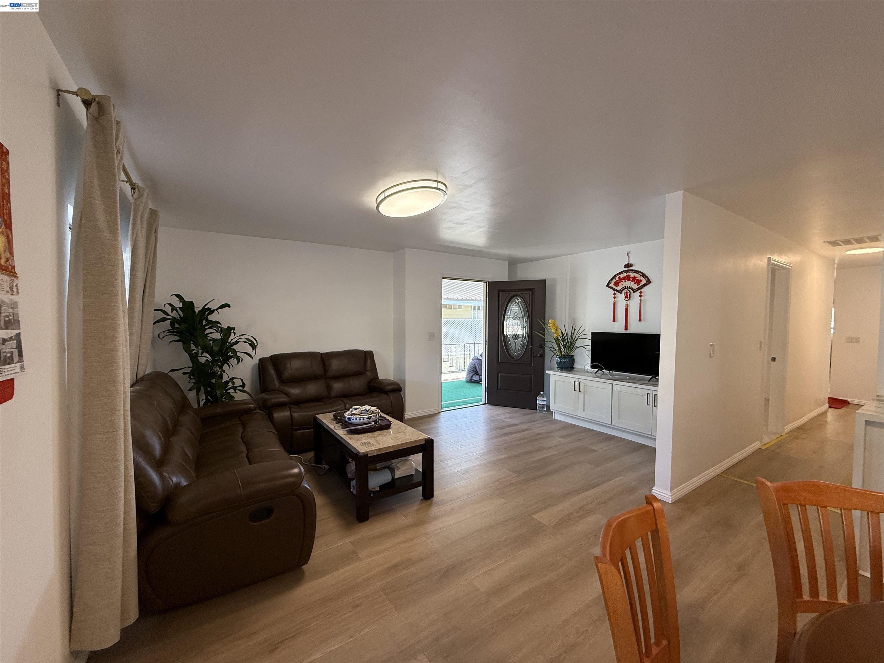 2151 Oakland Road, Unit 324 San Jose, CA 95131 - Photo 5 of 14 a living room with furniture and wooden floor