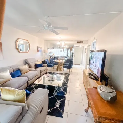 a living room with furniture and a clock