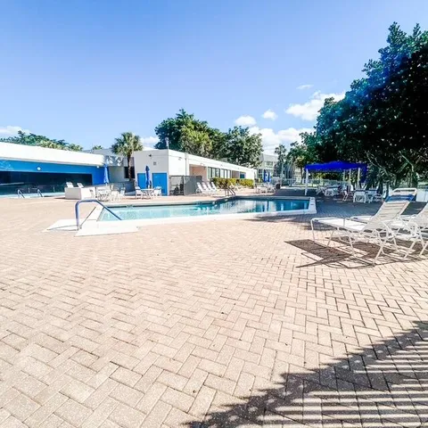 a view of a swimming pool and an outdoor space