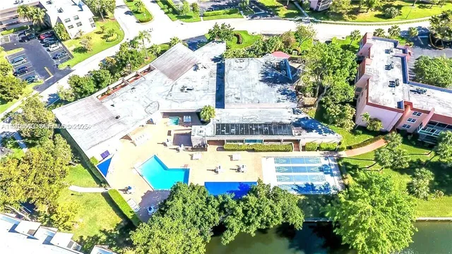 an aerial view of a house with a yard and garden