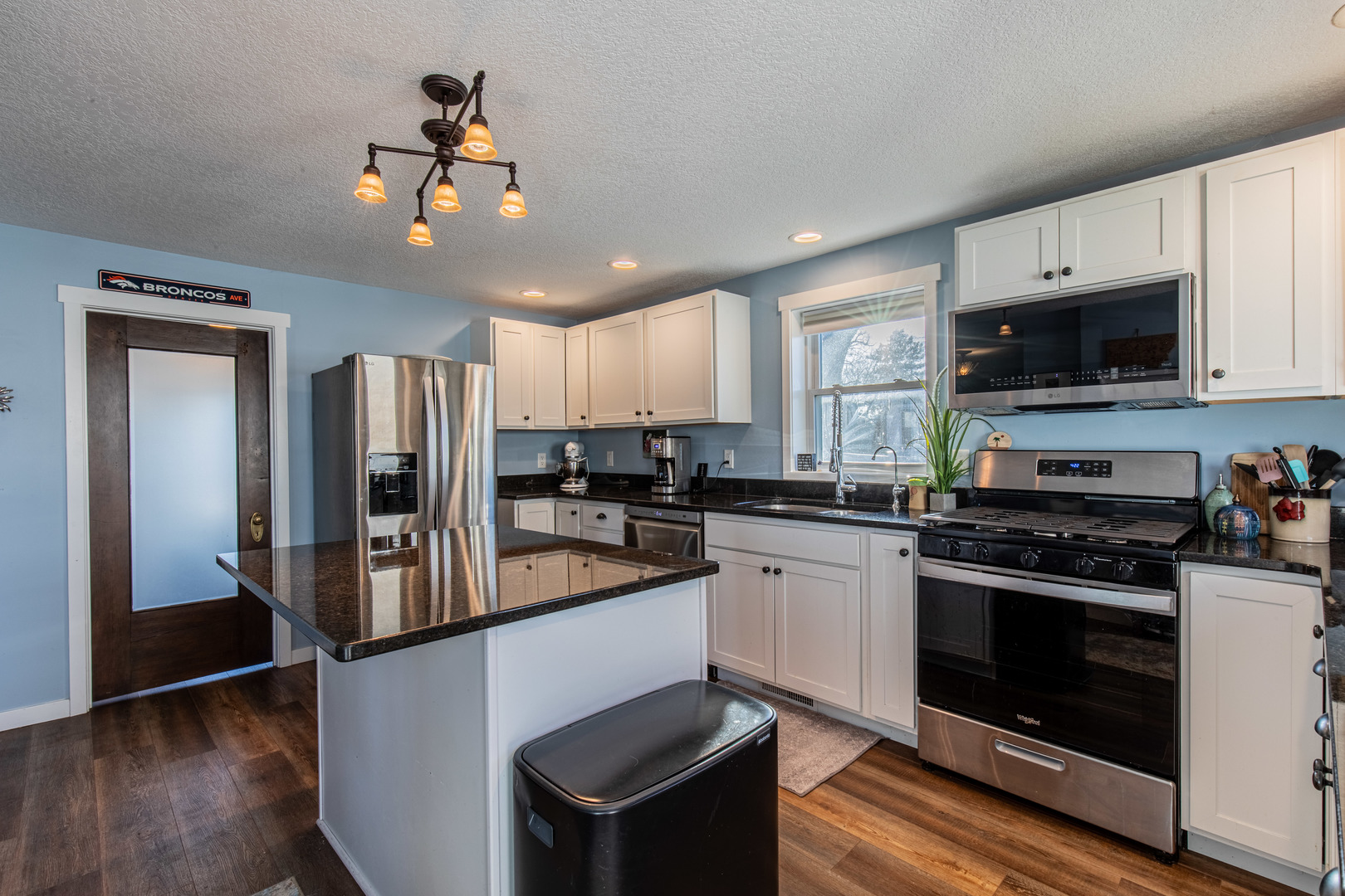 220 2nd Street Wyanet, IL 61379 - Photo 8 of 27 a kitchen with stainless steel appliances granite countertop a stove refrigerator sink and microwave