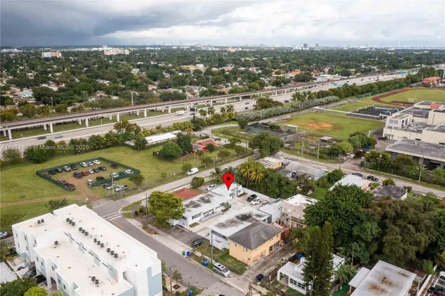 an aerial view of residential houses with outdoor space