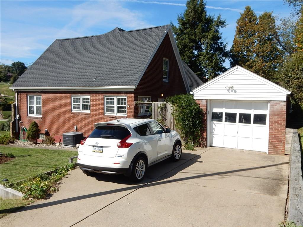 327 McClelland Road Canonsburg, PA 15317 - Photo 2 of 25 A view of the garage and side of the home, there is plenty of parking here as well as extra parking (big enough for a large motor home) off to the right.