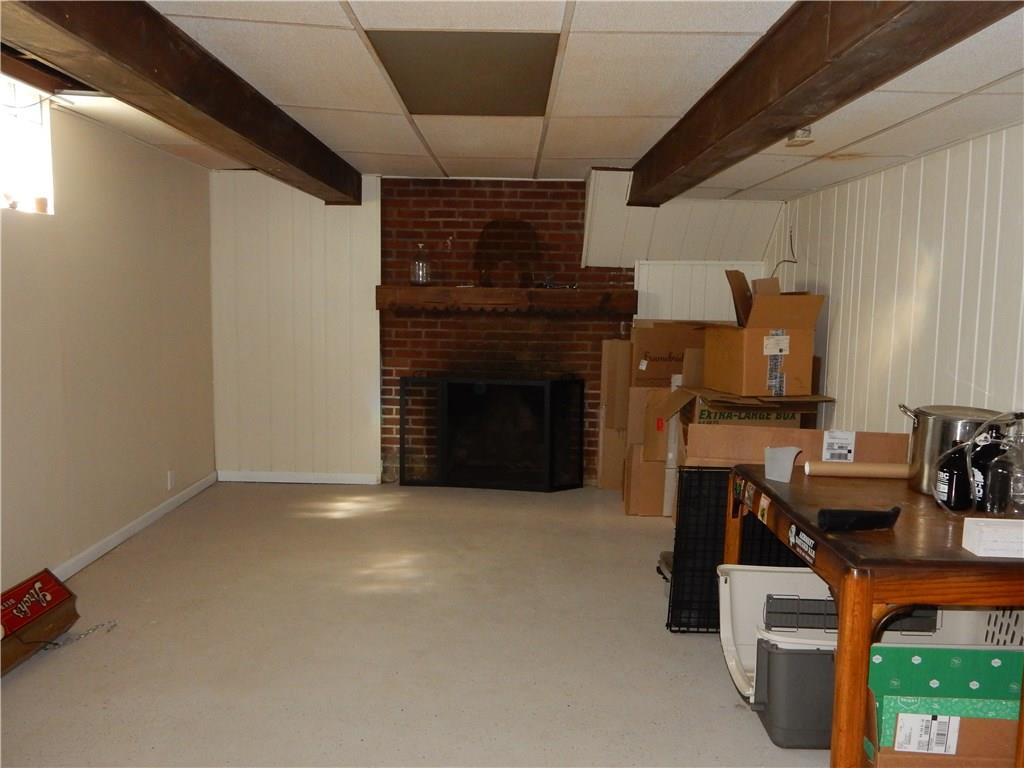 327 McClelland Road Canonsburg, PA 15317 - Photo 23 of 25 Here is the partially finished game room with a decorative fireplace and so much potential. The basement is absolutely huge.