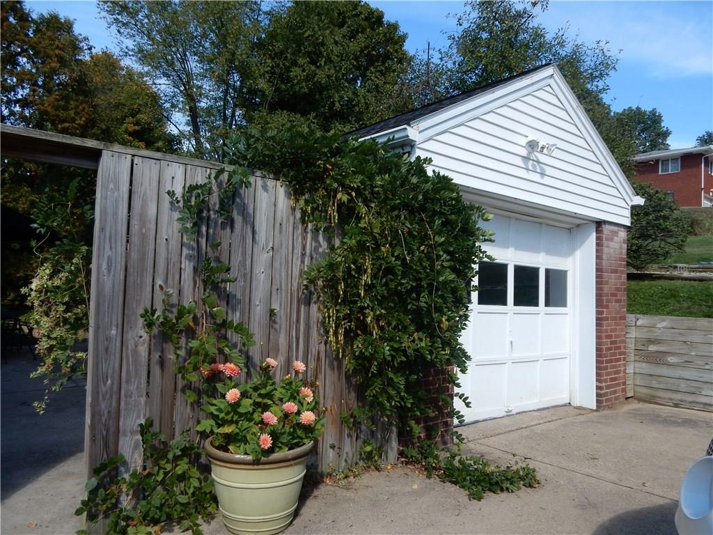 327 McClelland Road Canonsburg, PA 15317 - Photo 7 of 25 1 car detached garage with a privacy wall, the Wisteria is beautiful in the spring!