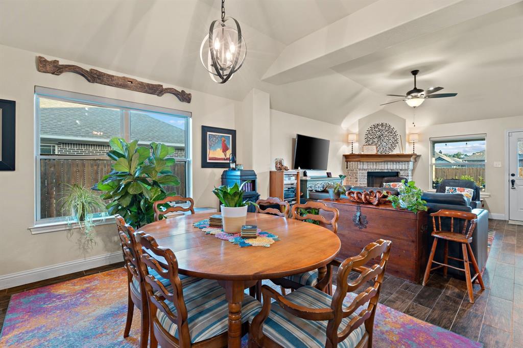 904 Sam Street Springtown, TX 76082 - Photo 12 of 30 a view of a dining room with furniture window and wooden floor