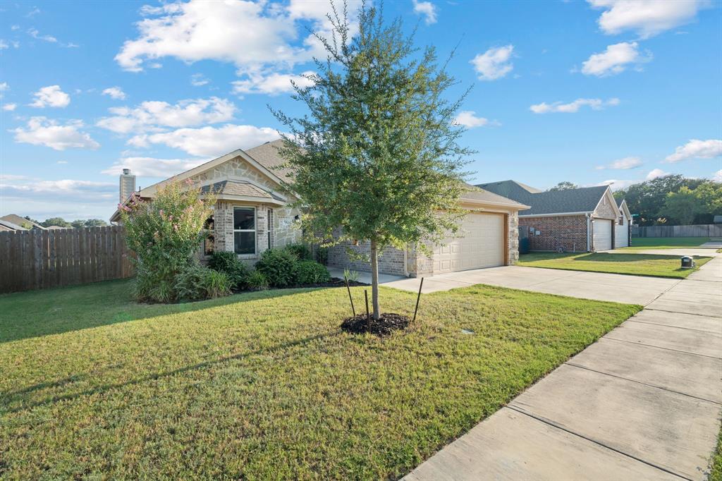 904 Sam Street Springtown, TX 76082 - Photo 2 of 30 a house with swimming pool in front of it