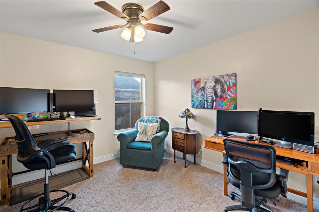 904 Sam Street Springtown, TX 76082 - Photo 21 of 30 a view of a workspace with furniture and a window