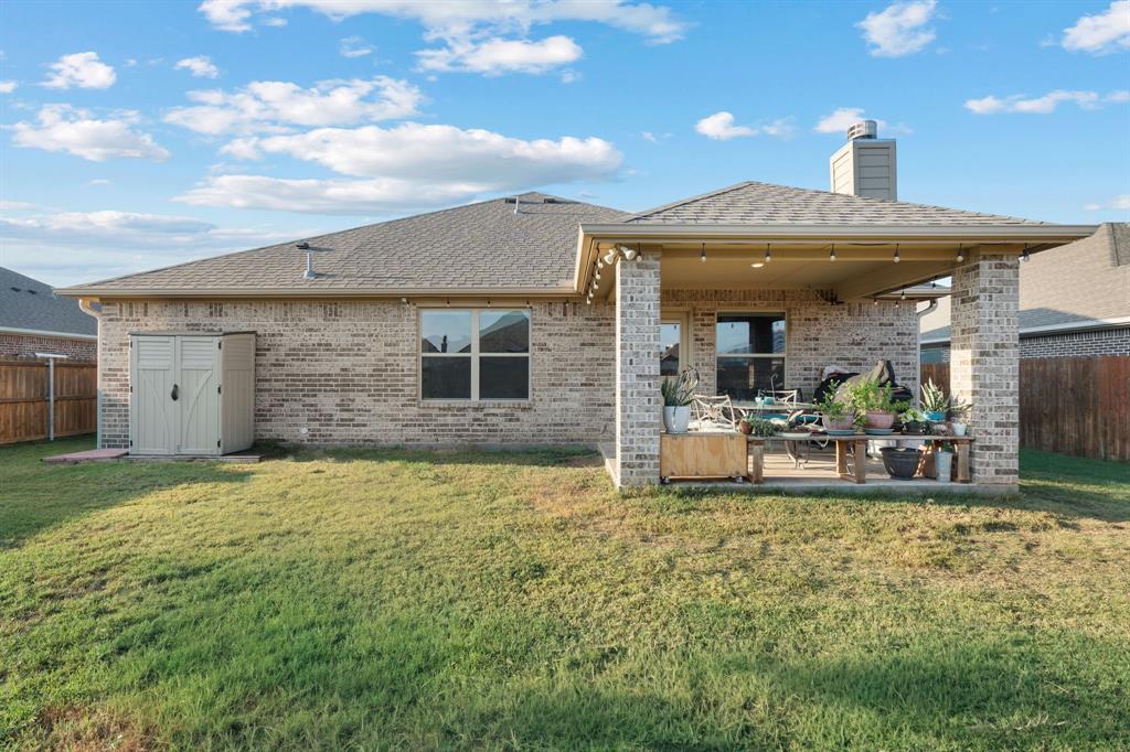 904 Sam Street Springtown, TX 76082 - Photo 23 of 30 a front view of house with yard and outdoor seating