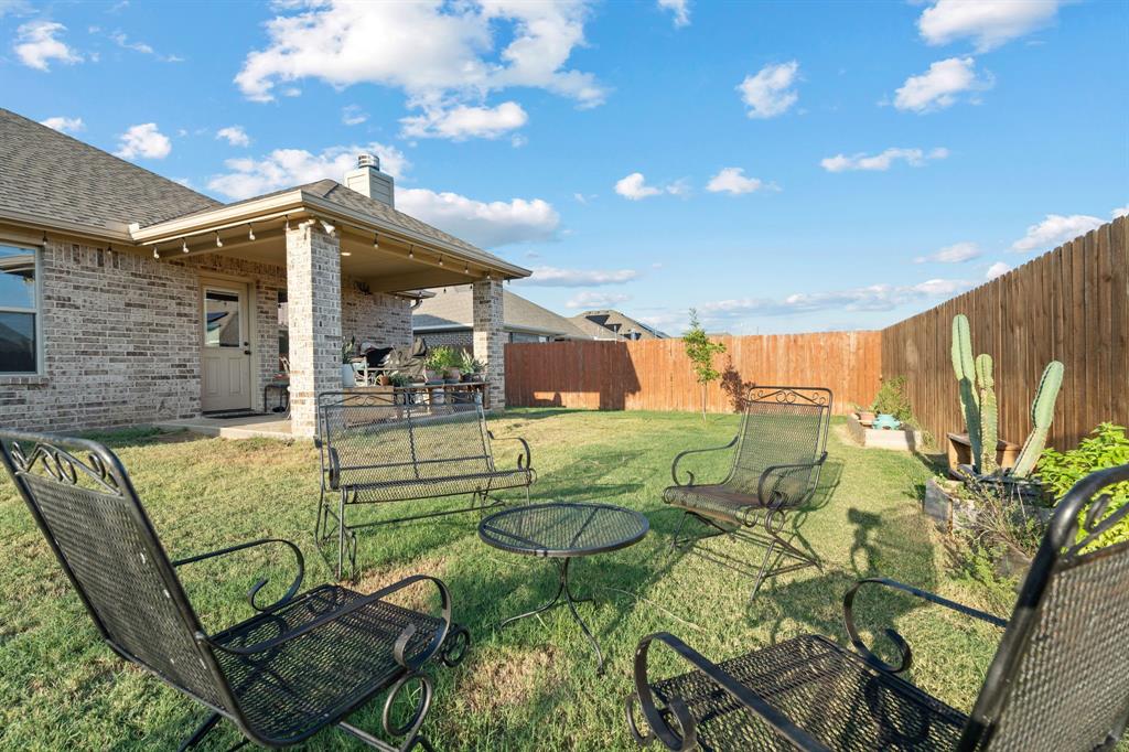 904 Sam Street Springtown, TX 76082 - Photo 24 of 30 a view of outdoor dining space with a patio