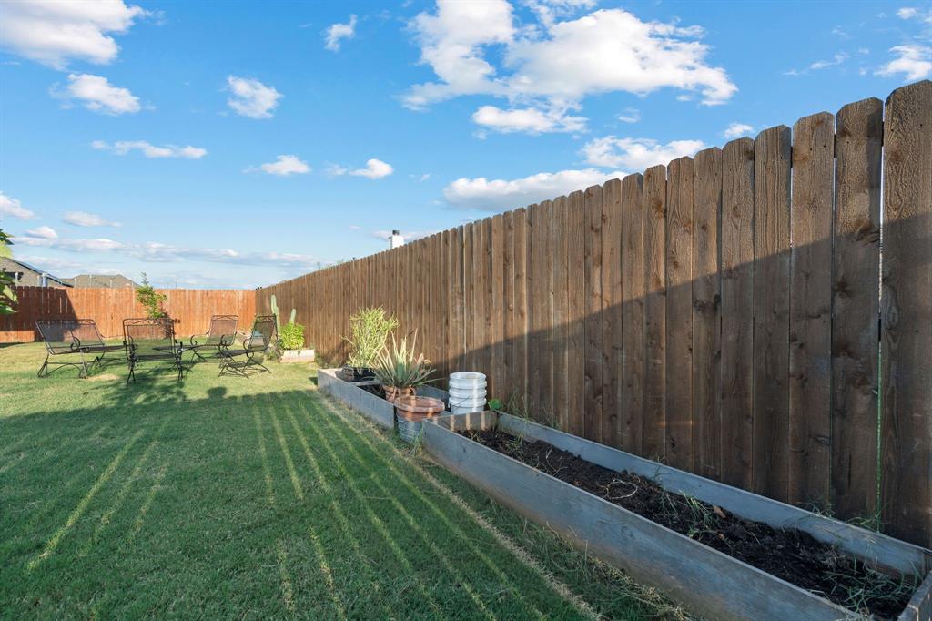 904 Sam Street Springtown, TX 76082 - Photo 26 of 30 a view of a backyard with sitting area