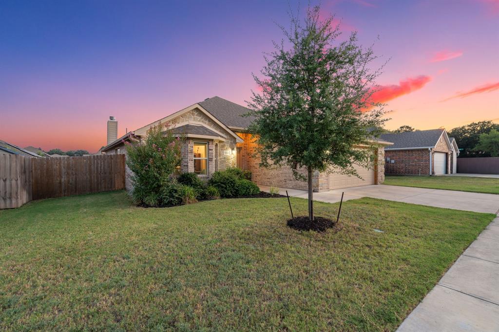 904 Sam Street Springtown, TX 76082 - Photo 29 of 30 a house view with a garden space