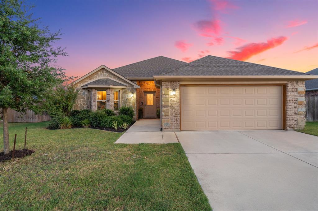 904 Sam Street Springtown, TX 76082 - Photo 4 of 30 a front view of a house with yard