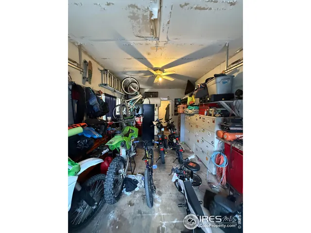 a utility room with wooden floor washer and dryer