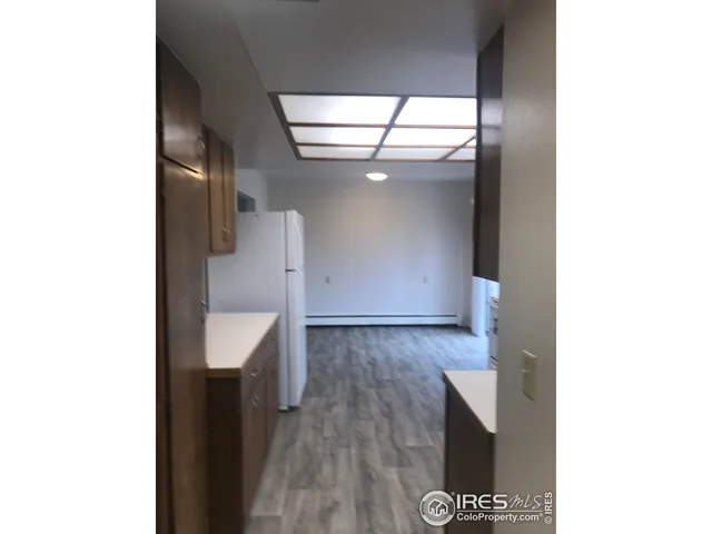 a view of a bathroom with a sink and a mirror