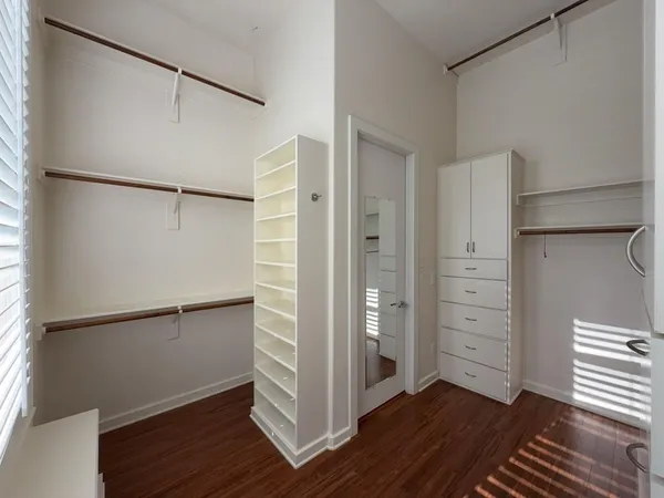 a kitchen with a sink and lots of wooden cabinets