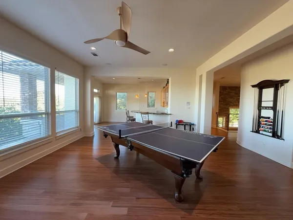 a kitchen with a sink cabinets and wooden floor