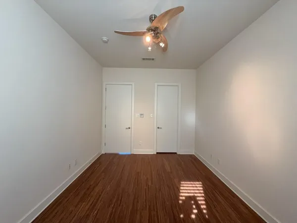 a view of a balcony with chairs