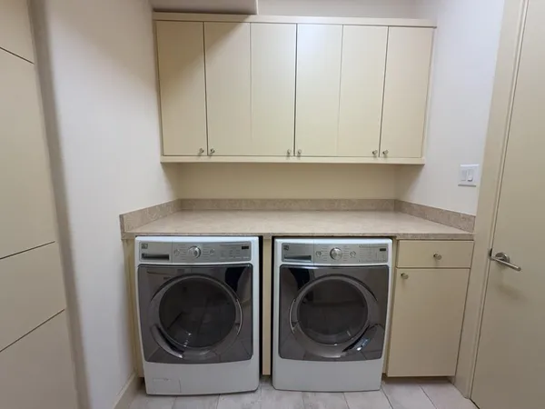 a bathroom with a granite countertop sink and mirror