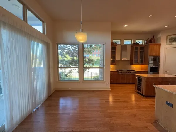 a kitchen with stainless steel appliances granite countertop a stove and a refrigerator