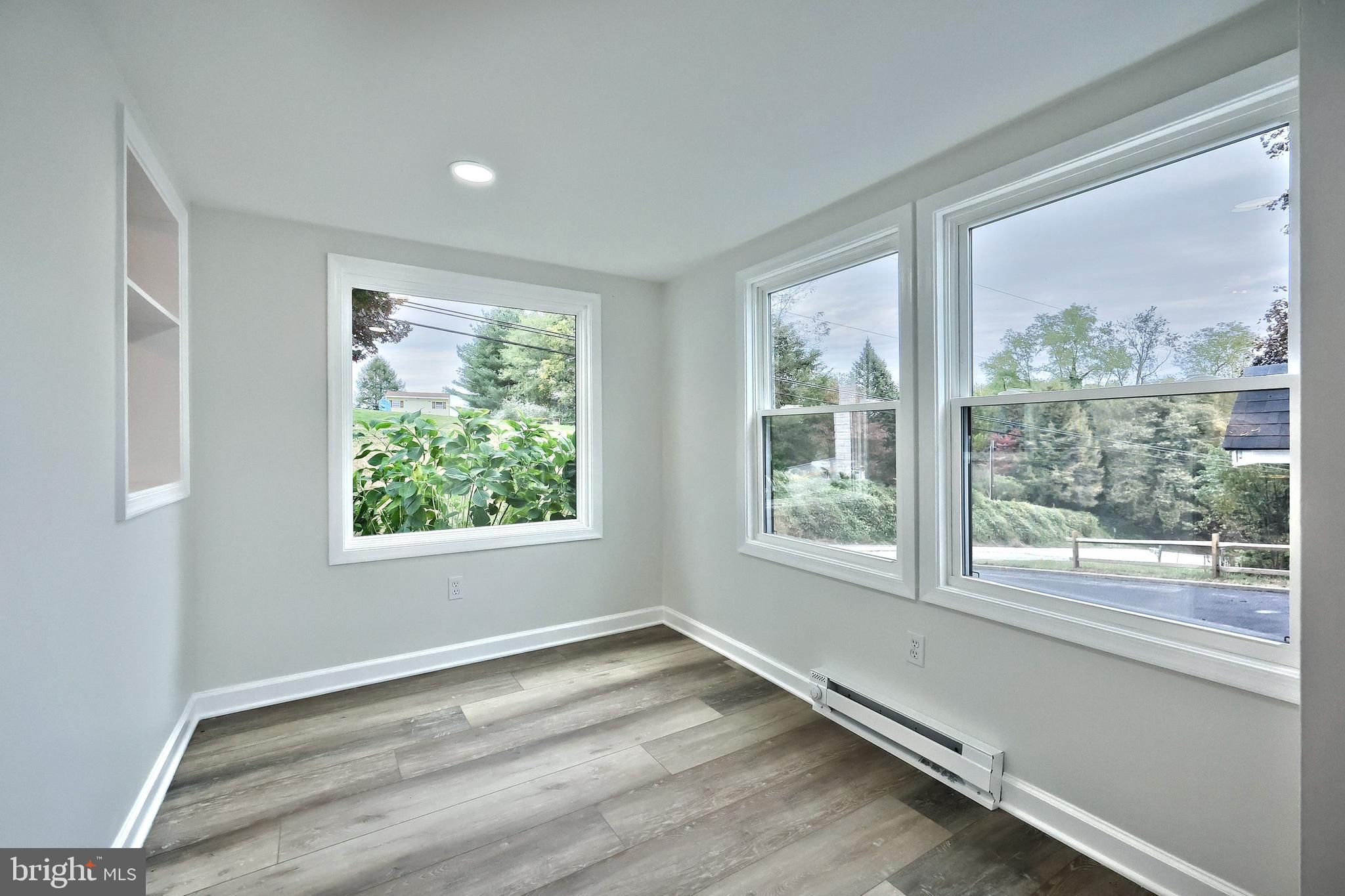 3641 River Road Conestoga, PA 17516 - Photo 30 of 61 a view of an empty room with wooden floor and a window