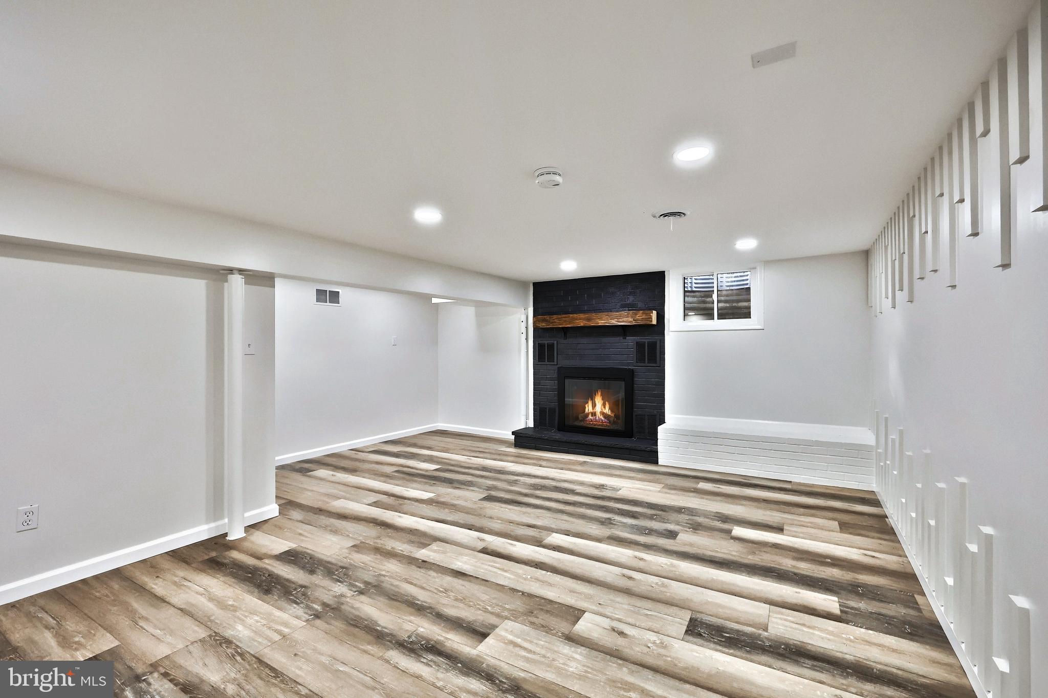 3641 River Road Conestoga, PA 17516 - Photo 46 of 61 a view of empty room with wooden floor and fireplace