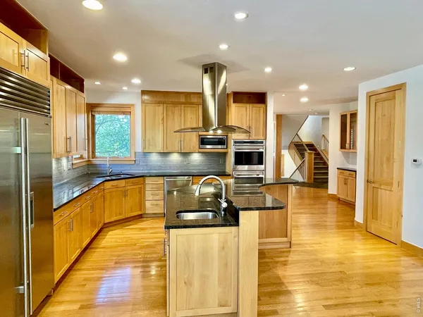 a bathroom with a granite countertop sink mirror and a