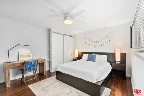 a bedroom with a bed and a table in it