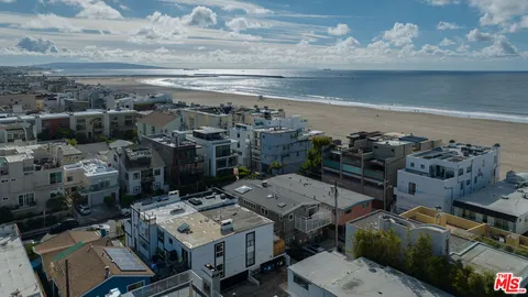 a picture of a bench in front of a wall