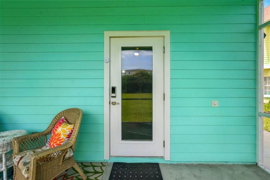 3073 Painters Walk Flagler Beach, FL 32136 - Photo 35 of 66 a front view of a house with wooden floor and a yard