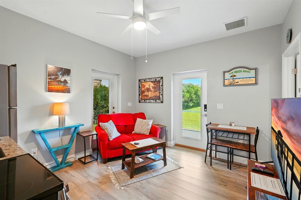 3073 Painters Walk Flagler Beach, FL 32136 - Photo 37 of 66 a living room with furniture and a wooden floor