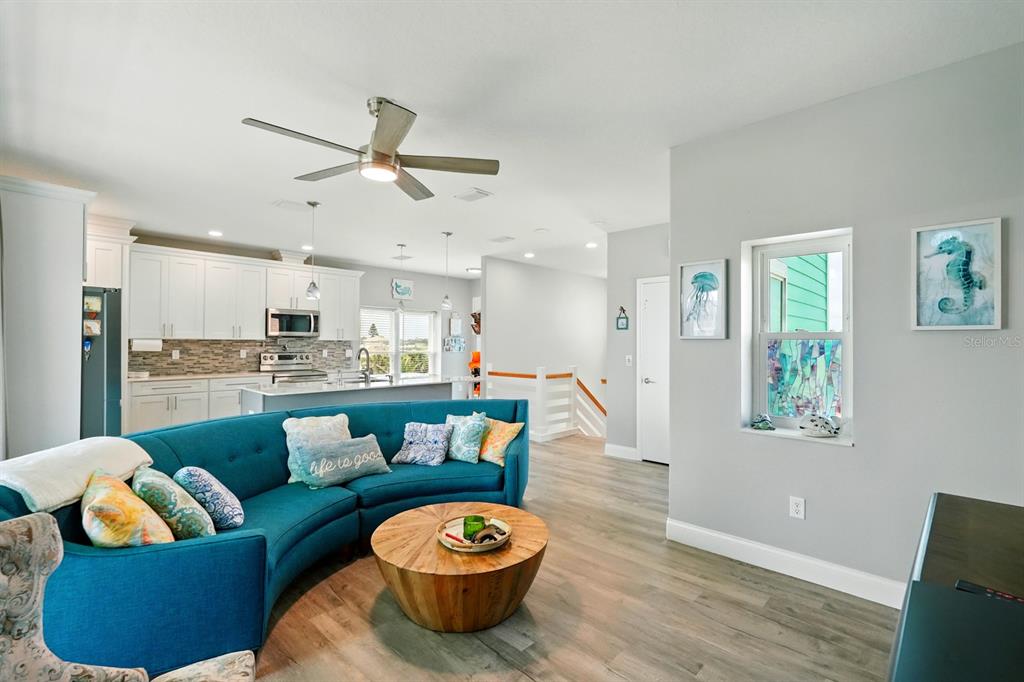 3073 Painters Walk Flagler Beach, FL 32136 - Photo 10 of 66 a living room with furniture and a wooden floor