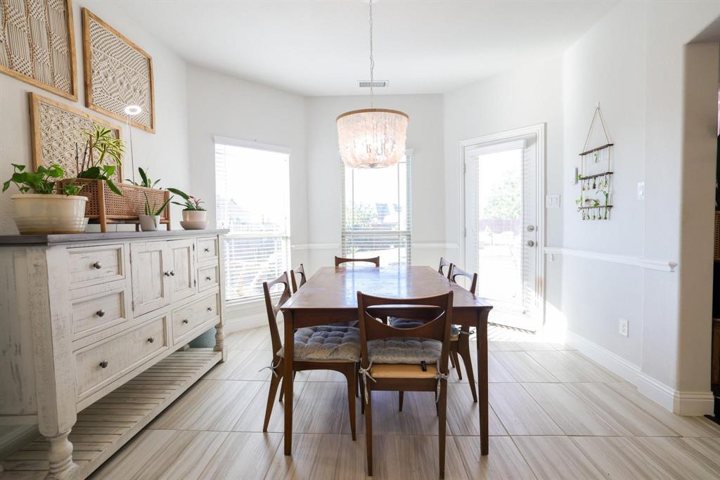 222 Crestview Drive Midlothian, TX 76065 - Photo 11 of 26 a view of a dining room with furniture window and wooden floor