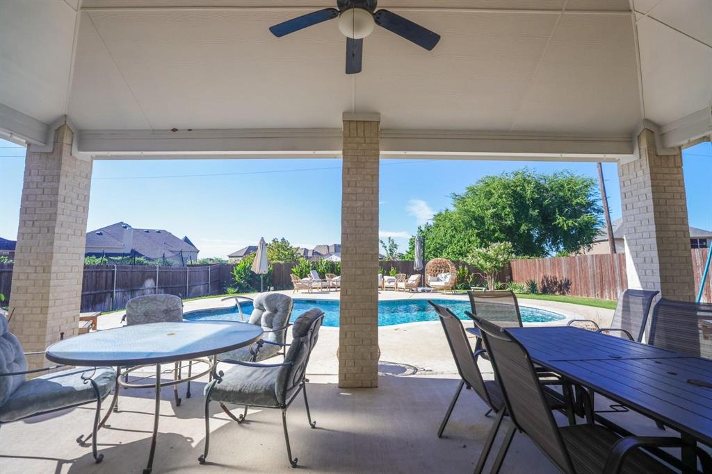 222 Crestview Drive Midlothian, TX 76065 - Photo 24 of 26 a view of a dining room with furniture window and wooden floor