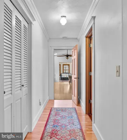 a view of a hallway with a bedroom