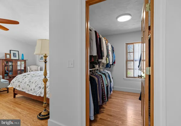 a view of a livingroom with furniture and closet