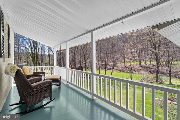 a view of balcony with furniture
