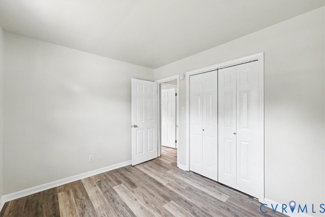 9737 Graves Road Petersburg, VA 23803 - Photo 17 of 41 Wood-finish flooring, neutral wall tones, white bi