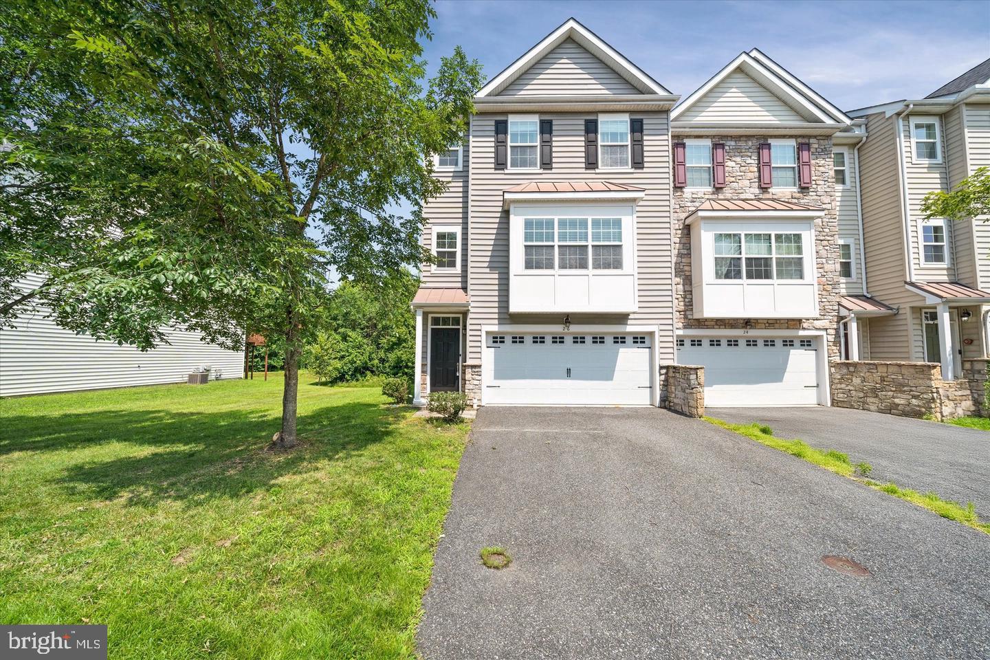 26 Munro Road Newark, DE 19711 - Photo 1 of 22 a front view of a house with a yard and trees