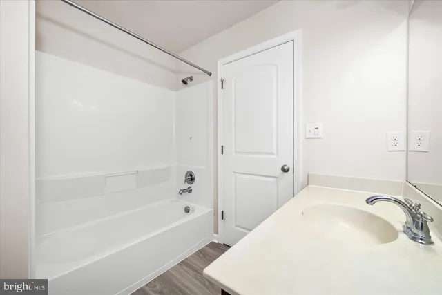 a bathroom with a sink and a bathtub