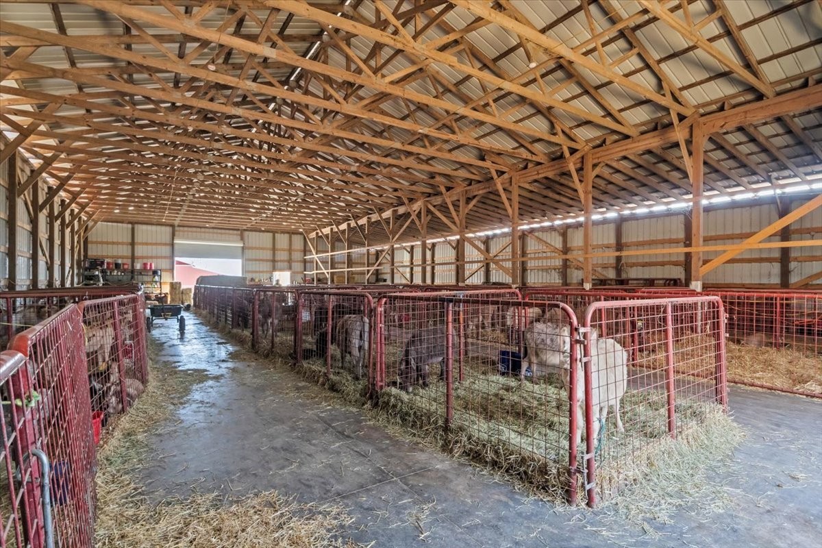 1429 Hunley Branch Road Charlotte, TN 37036 - Photo 13 of 51 a view of a storage room with wooden walls