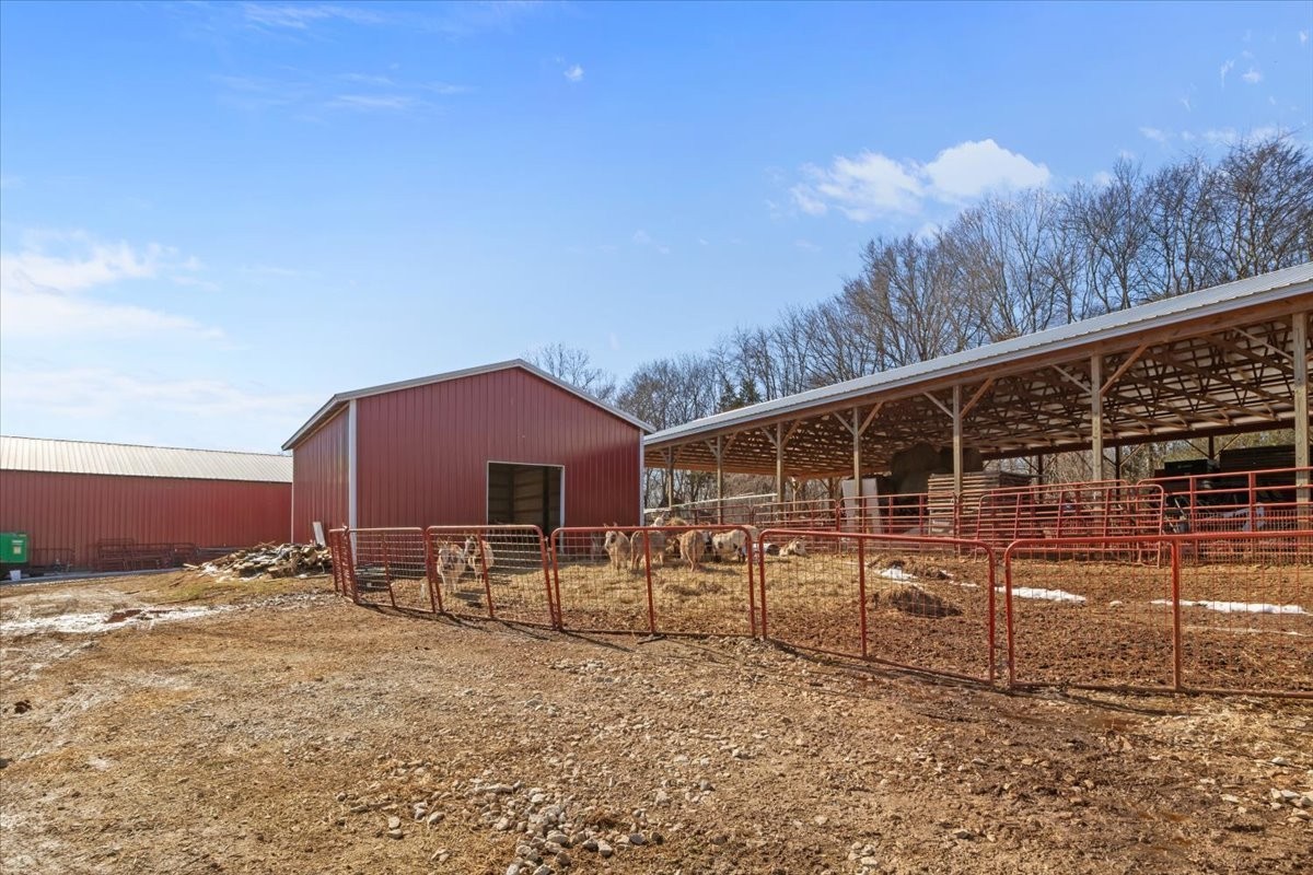 1429 Hunley Branch Road Charlotte, TN 37036 - Photo 28 of 51 a backyard of a house with table and chairs