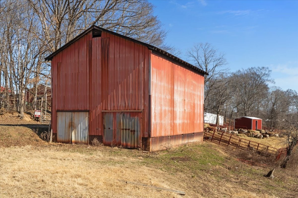 1429 Hunley Branch Road Charlotte, TN 37036 - Photo 33 of 51 a backyard of house with outdoor seating