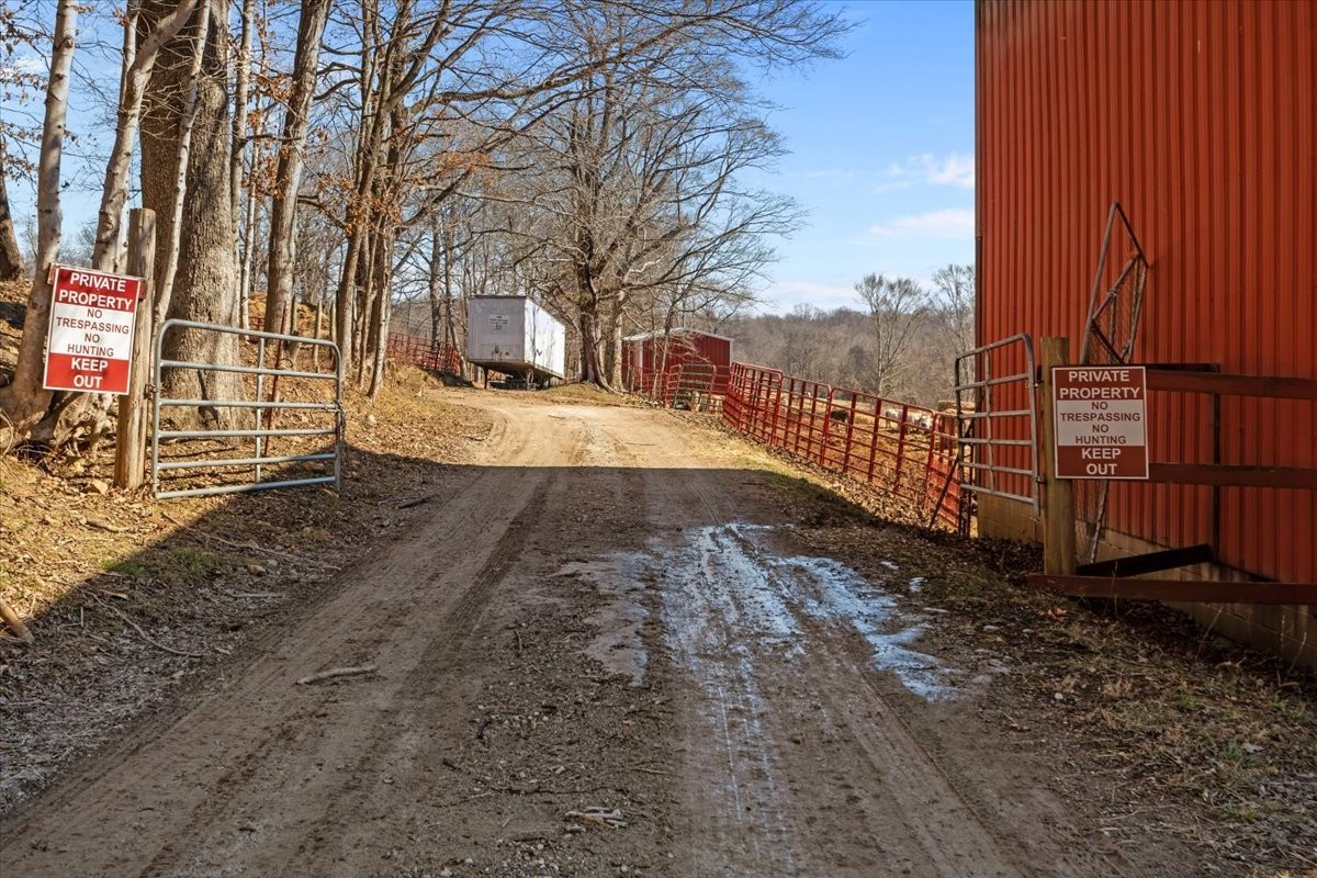 1429 Hunley Branch Road Charlotte, TN 37036 - Photo 4 of 51 a view of a yard with wooden fence