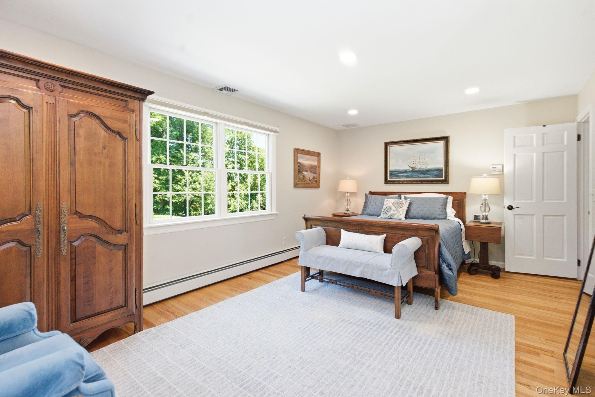 32 Bedell Road Katonah, NY 10536 - Photo 26 of 49 Generous proportions leave room for a sitting area in the primary bedroom.