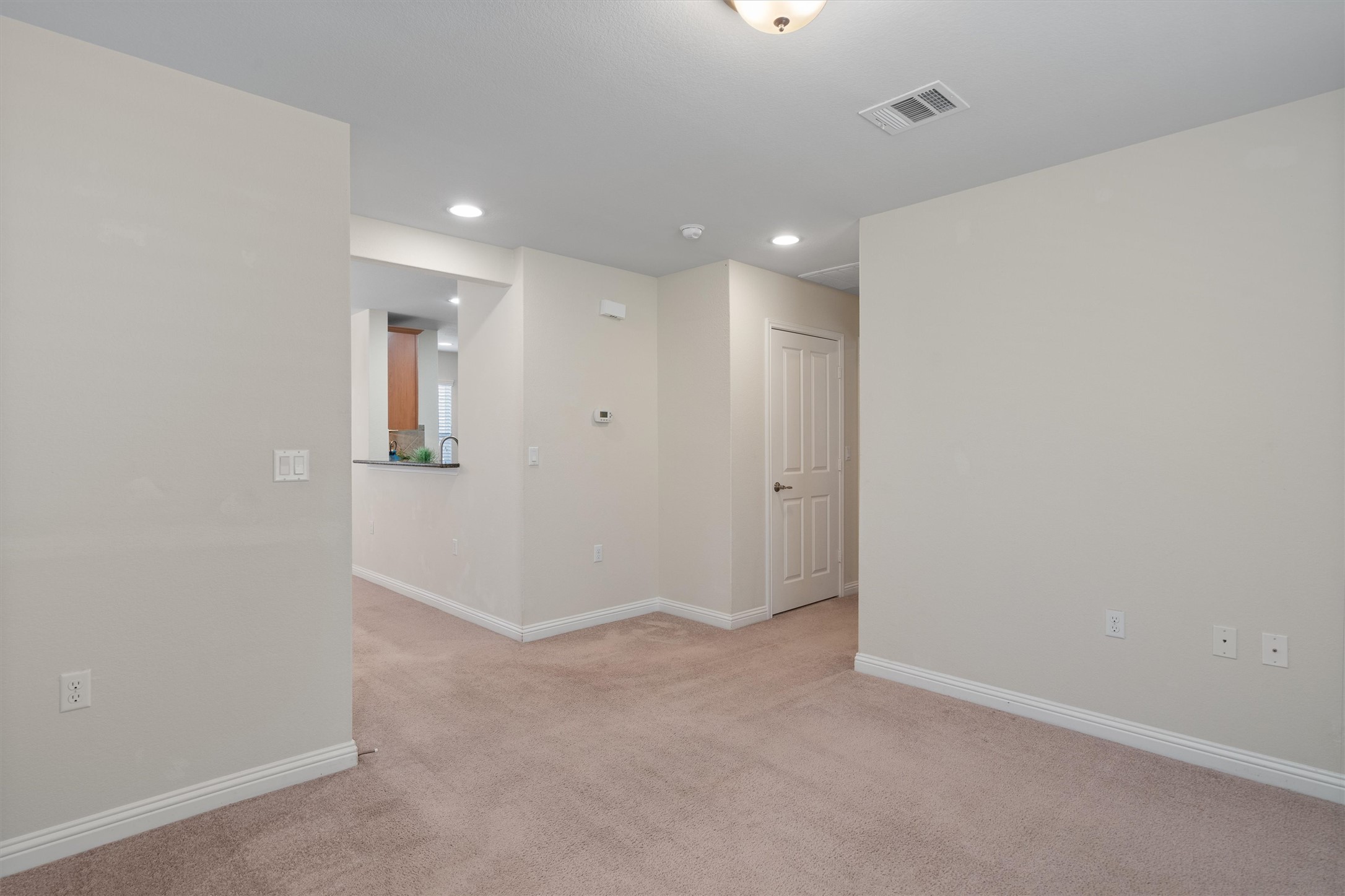 307 Kickapoo Creek Lane Georgetown, TX 78633 - Photo 18 of 30 Plush carpet flooring and clean neutral walls define this versatile open interior space.